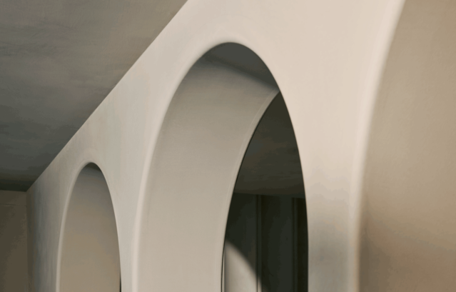 銀座にあるショールーム「 Layered Gallery by Valpaint」。写真はイタリア最高峰のVALPAINT（バルペイント）のカタログや図面を並べて打ち合わせをしている様子。このVALPAINTを中心に、意匠性の高い水性塗料がたくさん揃っており、インテリアデザインのインスピレーションを高めてくれるショールームとなっています。（完全予約制）写真は、Layered Gallery by ValpaintのR壁。VALPAINTを施工しており美しい陰影を描いている。